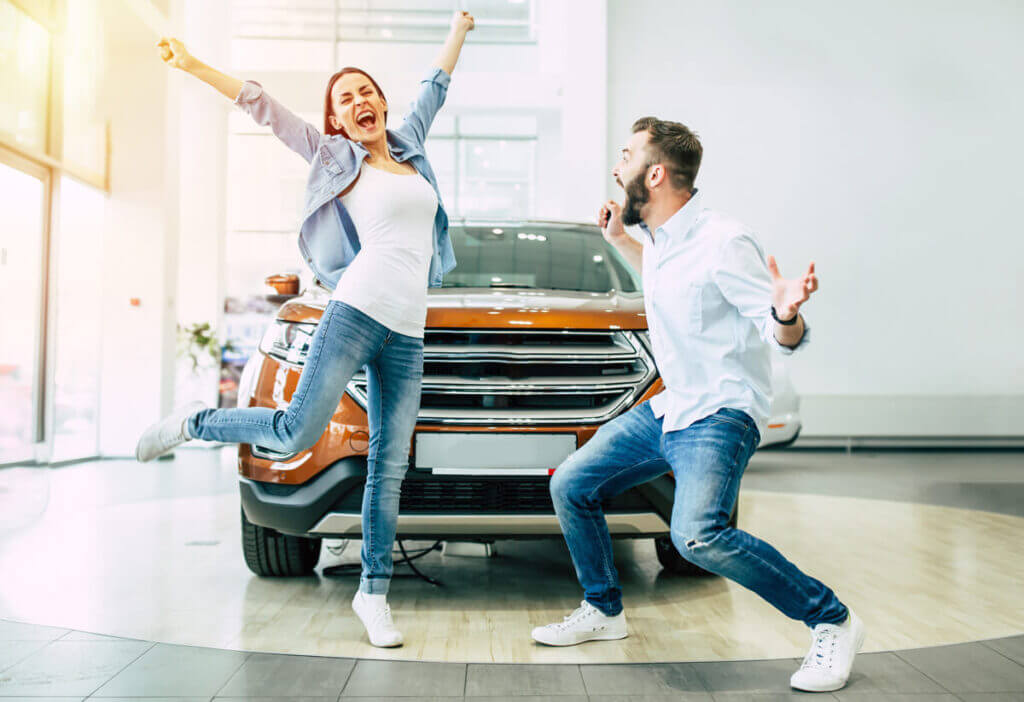 Husband and Wife happy they bought a car with bad credit