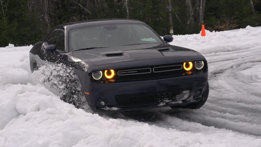 Black Dodge Challenger GT AWD Driving in Snow