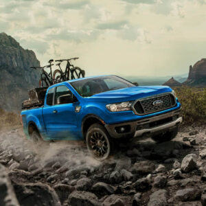 Overlanding Off Road Blue Ford Ranger riding on rocks