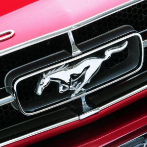 Mustang Logo Badge on Red Car