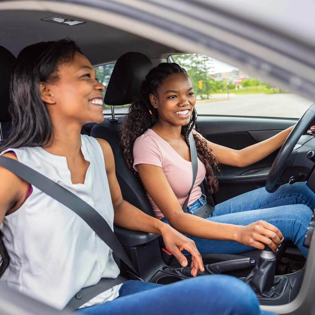 Teen and Mom Driving Car