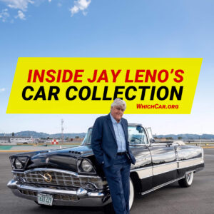 Jay leno posing in front of car collection