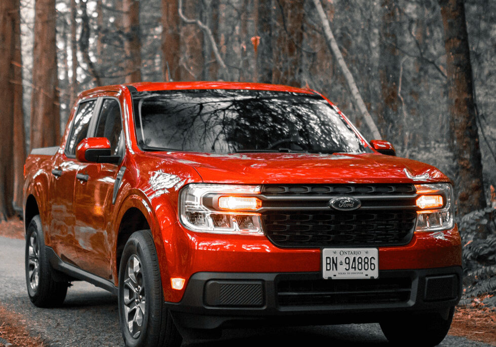 2022 Red Ford Maverick riding in the woods