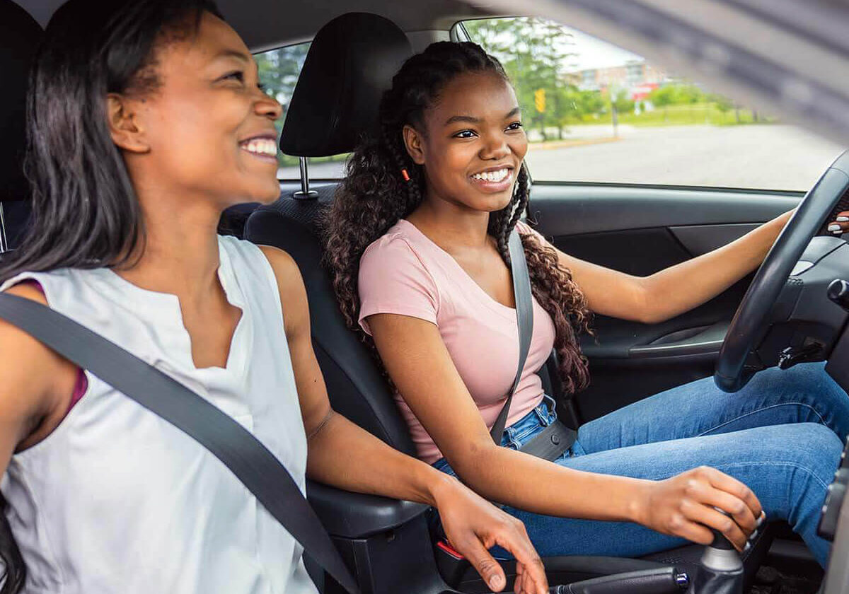 Teen and Mom Driving Car